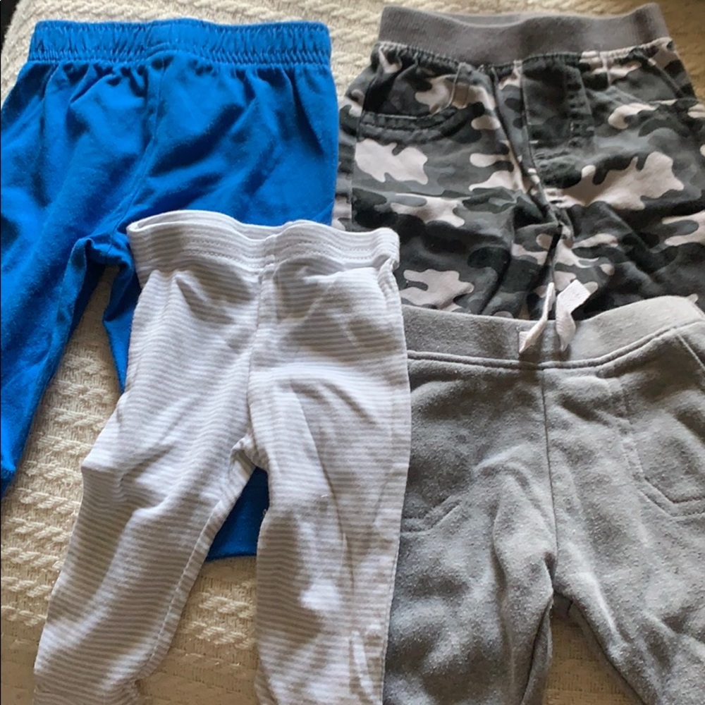 Four pairs of 0-3 months pants for boys